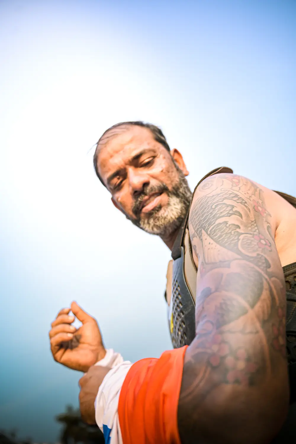 Portrait of Uday Ganguli in riding gear under an open sky